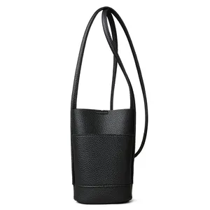 Minimalist black lychee leather crossbody phone bag with slim shoulder strap and front pocket