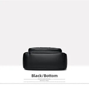 Detail view showing the wide bottom structure and lychee pattern of this black soft leather bag