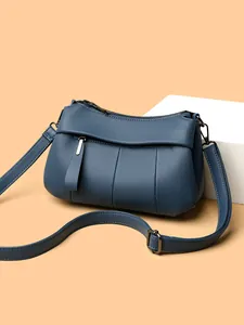 Blaue Umhängetasche aus weichem Leder für Damen mit Lychee-Narbung und Gurt