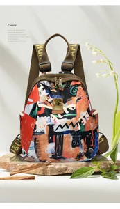 Detail of artistic graffiti print on durable travel backpack with vintage metal buckles
