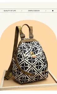 Detail view of large capacity backpack featuring black and white geometric patterns