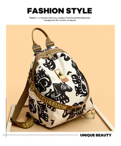 Detail of white canvas backpack with black animal print and brown woven shoulder straps