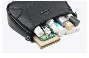 Detailed interior of black quilted soft leather bag showing large capacity for essentials