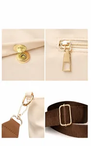 Detail of light gold hardware including magnetic snap and adjustable fabric shoulder strap