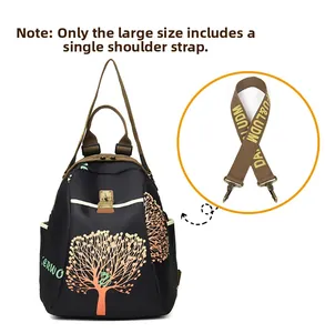Detail view of large travel backpack with colorful tree pattern and shoulder strap