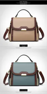 Detail of color-blocked leather handbags with lychee texture and white contrast stitching