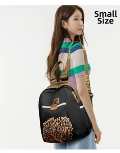 Asian model wearing small size black nylon backpack with orange tree print and logo straps