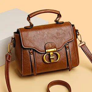 Brown soft texture crossbody bag with vintage bronze hardware and top handle for women