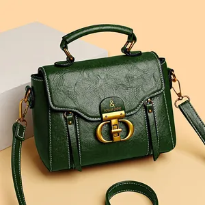 Retro green soft texture handbag with gold D-buckle and contrast stitching