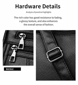 Detail of silver metal buckle and zipper on black lychee texture leather tote bag