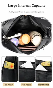Detail view of black tote bag interior showing large capacity and multi-pocket layout