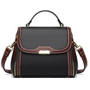 Retro black leather crossbody bag for middle-aged women with gold metal accents