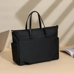 Stylish black nylon laptop tote bag with large capacity for women's office and commute