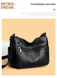 Macro shot of black lychee grain leather tote bag with functional multiple zipper pockets