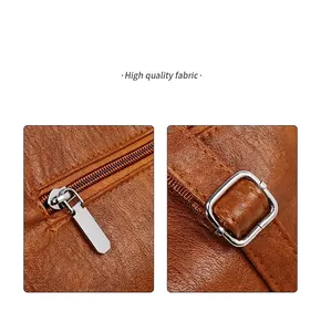 Close-up of brown litchi pattern leather texture with metal zipper and precise stitching