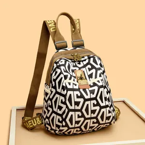 Lightweight nylon backpack with black white geometric print and brown woven straps