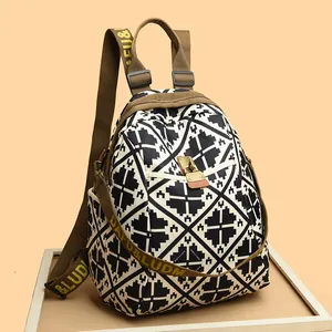 Large capacity geometric diamond pattern backpack with adjustable letter straps