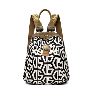 Women's lightweight travel backpack with black and white geometric pattern and brown straps