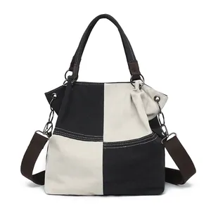 Minimalistische schwarz-weiße Patchwork-Canvas-Tasche mit verstellbarem Schultergurt