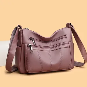 Mauve lychee leather tote bag with front zippers and wide shoulder strap for women