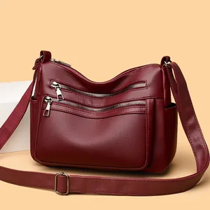 Sac bandoulière bordeaux multi-couches avec texture litchi et fermetures argentées