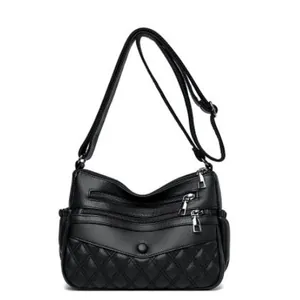 Sac à bandoulière noir en cuir pour femme avec fermetures éclair et détails matelassés