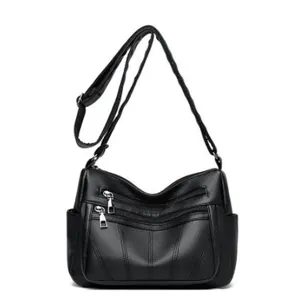 Chic black faux leather tote bag for women featuring classic lychee texture and multi-pockets