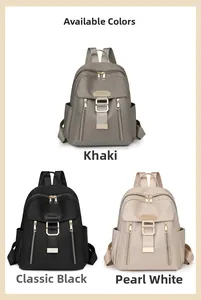 Three travel backpacks in khaki, black, and pearl white colors with nylon texture