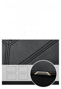 Macro shot of black lychee grain leather with waterproof texture and precise stitching
