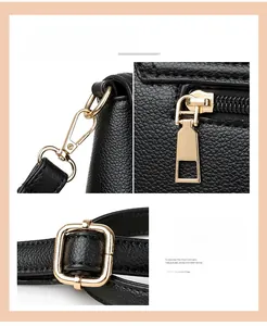 Detail of premium gold-plated hardware and black lychee grain leather on crossbody bag