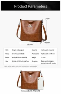 Detailed view showing dimensions 23.5x21x10.5cm of the brown pebble leather bucket bag