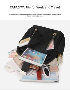 Detail of waterproof black nylon backpack showing main compartment holding iPad and daily items