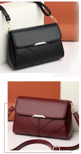 Detail view of classic flap crossbody bags in black and burgundy with V-shaped stitching