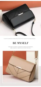 Detailed close-up of flap shoulder bags with V-shaped stitching and metal lock accents