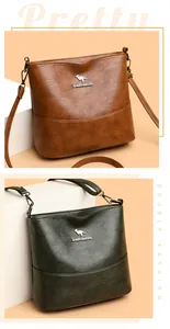 Detail showing brown and dark green bucket bags with kangaroo logos and wide straps