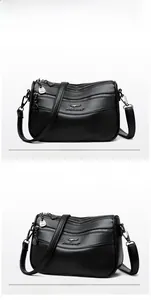 Front and side views of black pebbled leather multi-layer shoulder bag with silver zippers