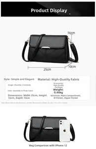 Detailed view of black pebbled leather crossbody bag with dimensions 25x16x10cm and V-buckle