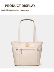 Front detail of minimalist off-white tote bag with brown leather handles and zipper pocket