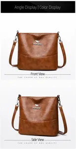 Detail of brown leather bucket bag showing textured finish and adjustable metal buckles