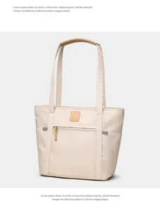 Detail of waterproof nylon tote bag showing front zipper pocket and leather handles