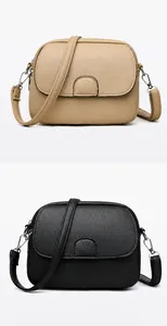 Detailed comparison of khaki and black crossbody bags showing litchi leather texture