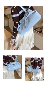 Close-up of light blue large capacity tote bag with soft PU leather texture and shoulder strap