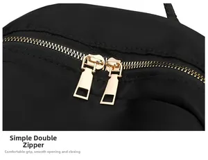 Close-up of smooth dual metal zippers on high-quality waterproof nylon backpack