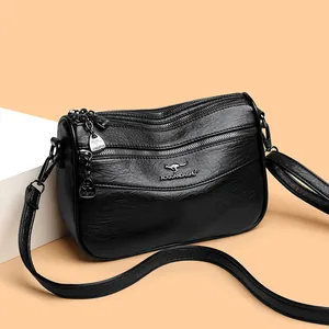 Fashionable black multi-layer crossbody bag with premium lychee grain leather texture
