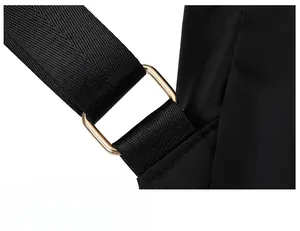 Detail of black nylon strap with high-gloss gold metal rectangle buckle on the backpack
