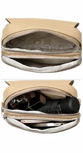 Detail view of the mini round crossbody bag with double zipper and multi-pocket interior
