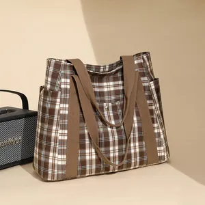 Brown plaid tote bag for college commute featuring large capacity and multi-pocket design