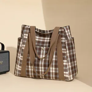 Brown plaid canvas tote bag with side pockets and large capacity for daily commuting