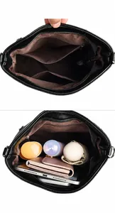 Detailed internal compartments of a black bucket bag with zipper pockets and spacious main pouch