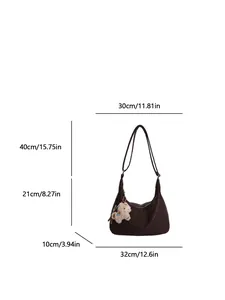 Coffee brown half-moon shoulder bag with plush sheep pendant and size measurements